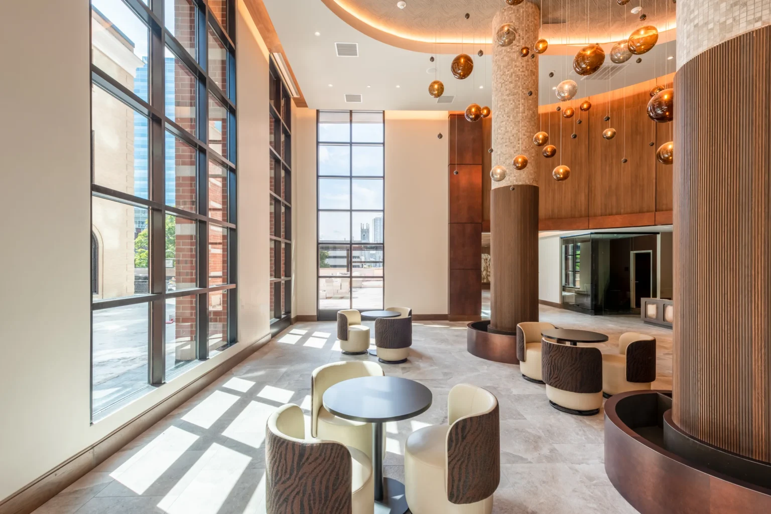 Altitude Worcester lobby with lounge seating and copper pendant lights.